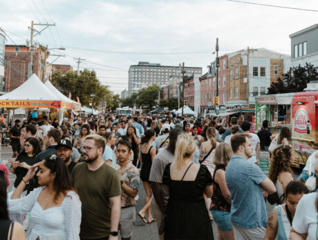 A large crowd gathers at the 2nd Street Festival in Northern Liberties, with food trunks and tents along a car-free street.