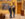 Two people wearing blazers and jeans look up at framed artwork in a gallery at the Barnes Foundation.