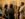 A group of visitors stand in conversation surrounded by artwork at the Barnes Foundation's galleries.
