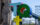 A multi-colored sculpture that says "TQ+" stands outdoors. The Delaware River and Benjamin Franklin Bridge are visible in the background.