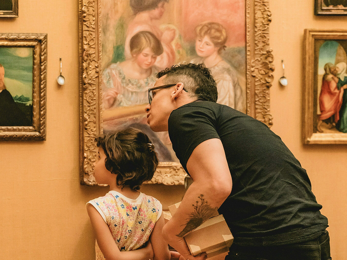 An adult and child admire paintings at the Barnes Foundation during a family-friendyl event.