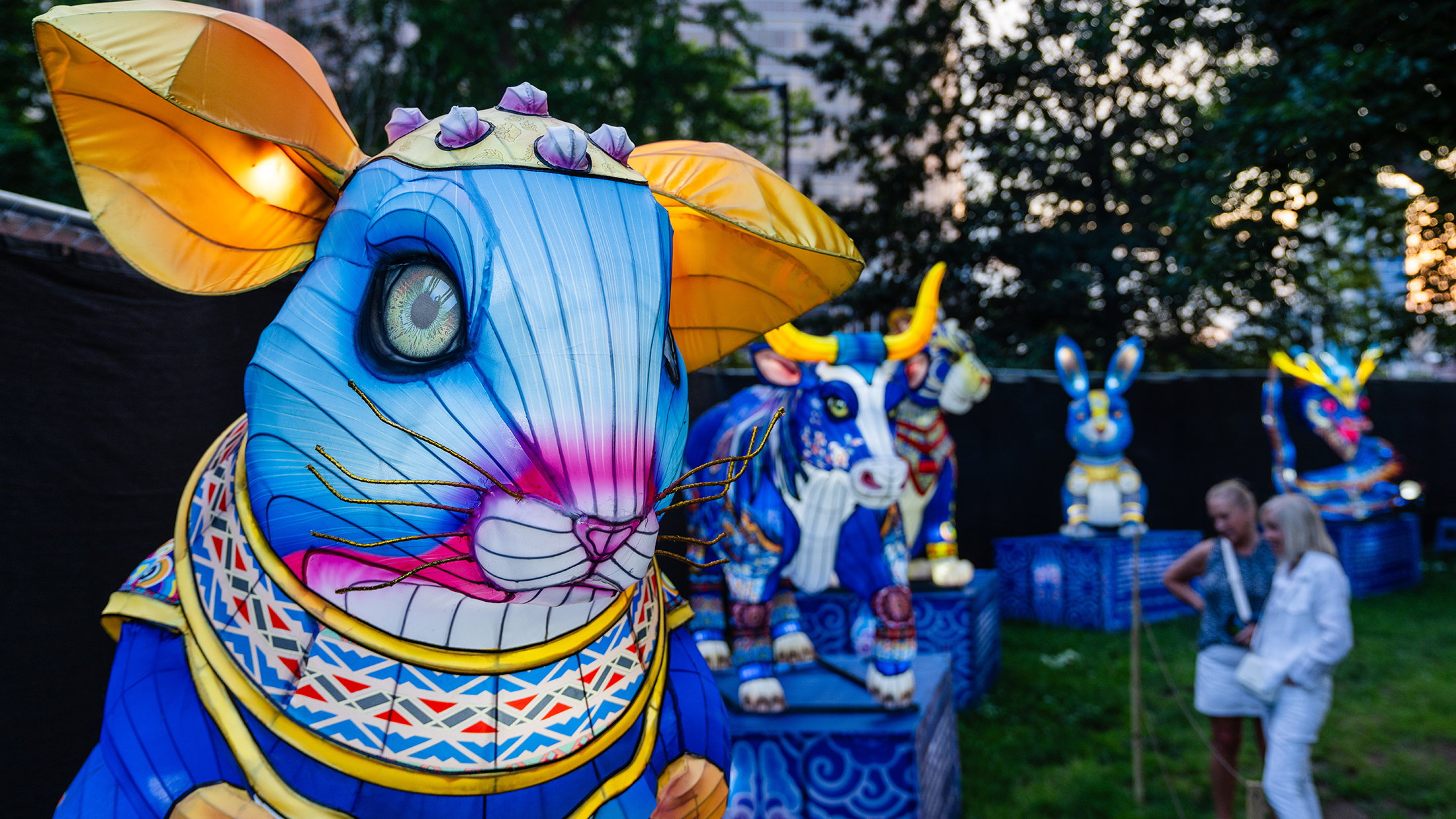 A colorful lantern sculpture of a blue mouse stands among other zodiac animal lanterns at the Chinese Lantern Festival.