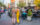 Two women walk past the Singing Fountain on East Passyunk Avenue, surrounded by shops, restaurants and people enjoying the neighborhood.