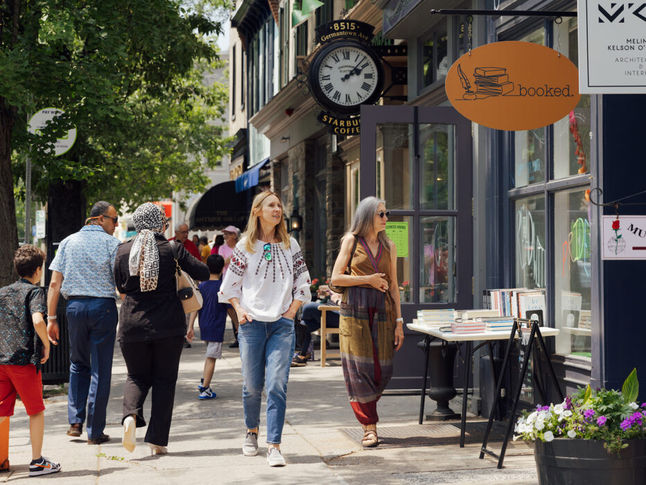 Shoppers stroll along Germantown Avenue past boutiques, shops, bookstores and cafes in Chestnut Hill.