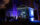Visitors gather outside an illuminated mausoleum at Laurel Hill Cemetery during the Soul Crawl nighttime tour.