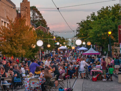 Crowds fill a car-free street in Mt. Airy for an evening Supper Session, with outdoor dining and live entertainment.