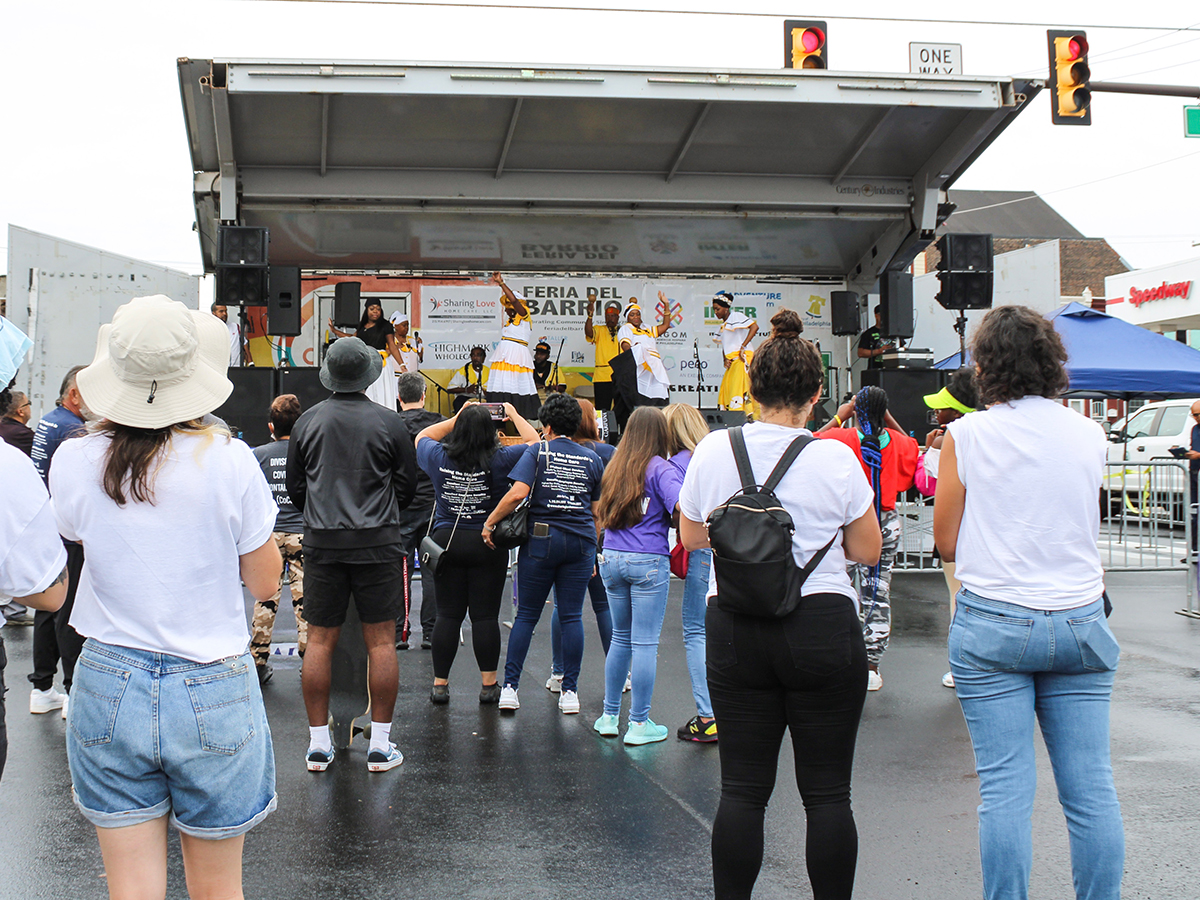 A crowd watches dancers on stage at La Feria del Barrio event in Philadelphia.
