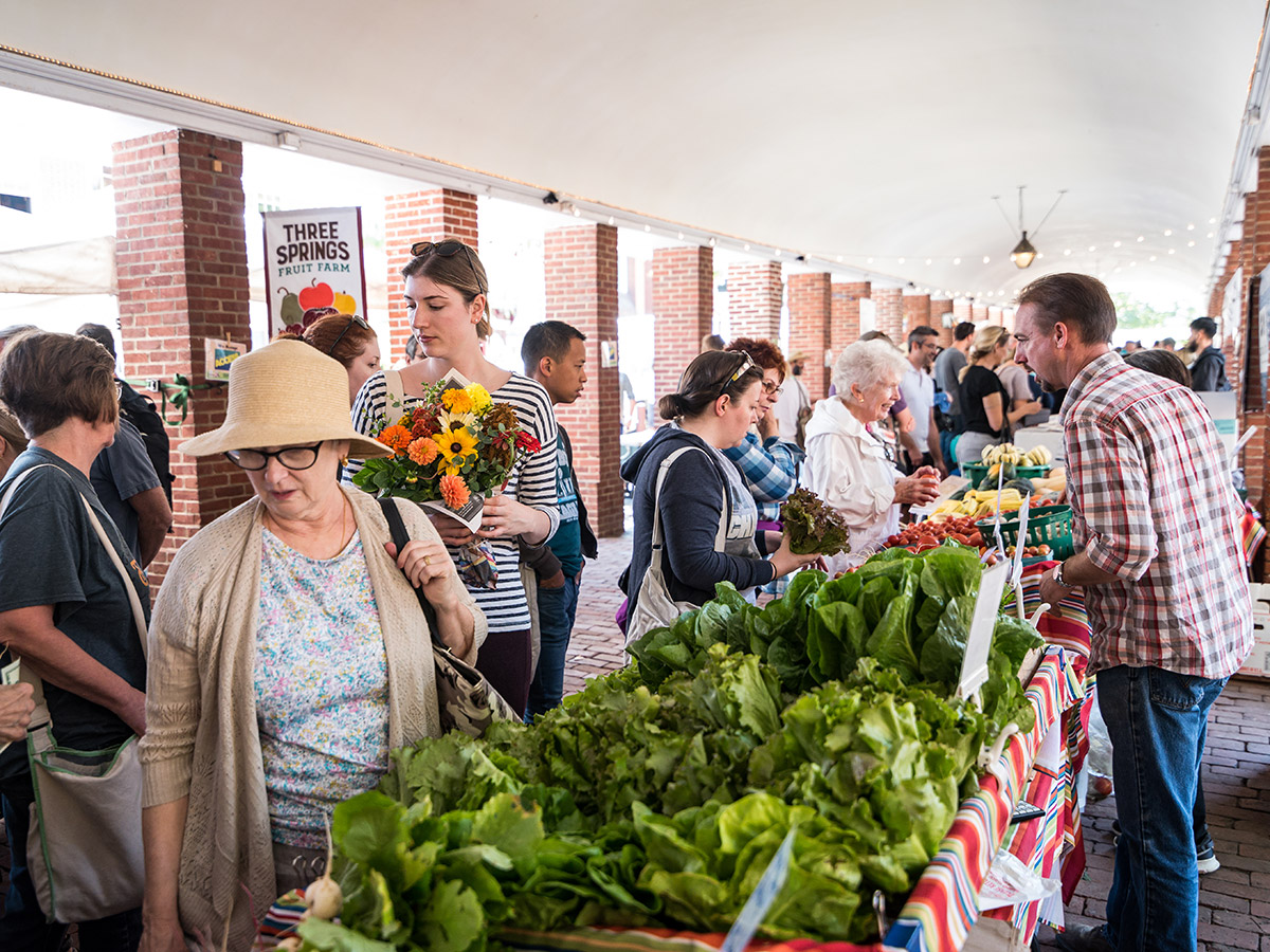 Shoppers browse fresh produce and flowers at Headhouse Farmers Market.