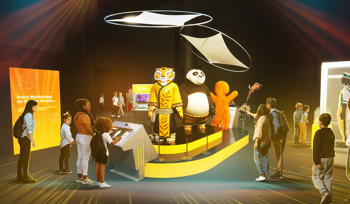 Families admire and interact with life-sized character costumes of Tigress, Po, and Gingy from DreamWorks films.