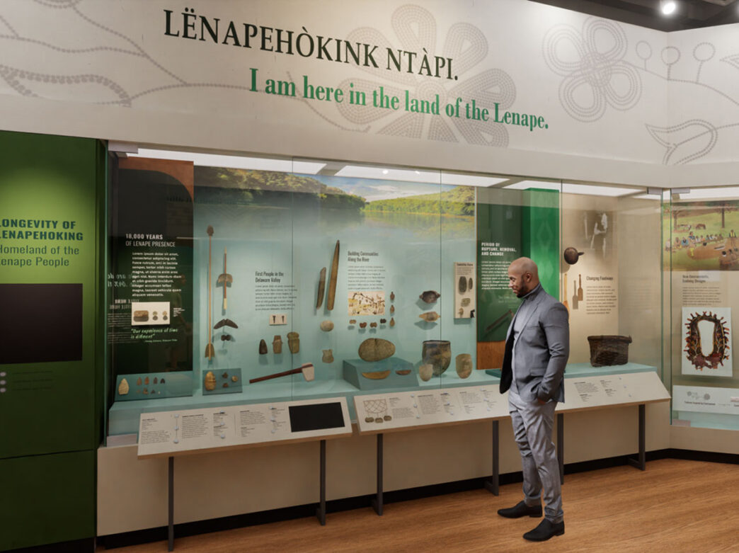 A visitors explores a museum exhibit highlight the thousands of years of Lenape history and artifacts.