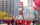 A large Cat in the Hat float being marched down the Benjamin Franklin Parkway during the Thanksgiving Parade in Philadelphia, with City Hall in the background and crowds of people watching from the sidewalks.