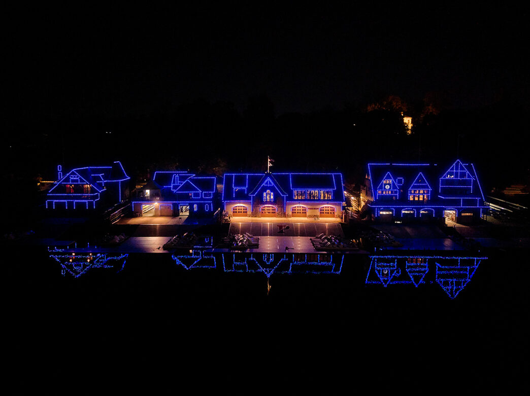 Boathouse Row, 19th-century boathouses lining the Schuylkill River in Philadelphia, is illuminated with blue white lights after sunset.