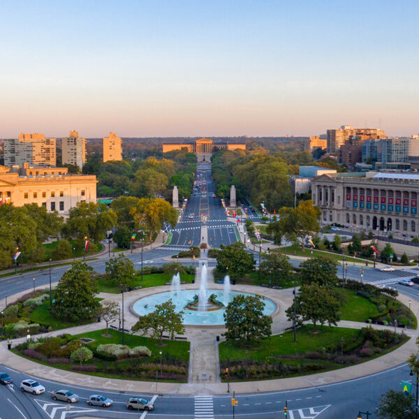 An aerial view of the Benjamin Franklin Parkway overlooking the fountain at Logan Square, the Barnes Foundation, Parkway Central Library and the Philadelphia Museum of Art.