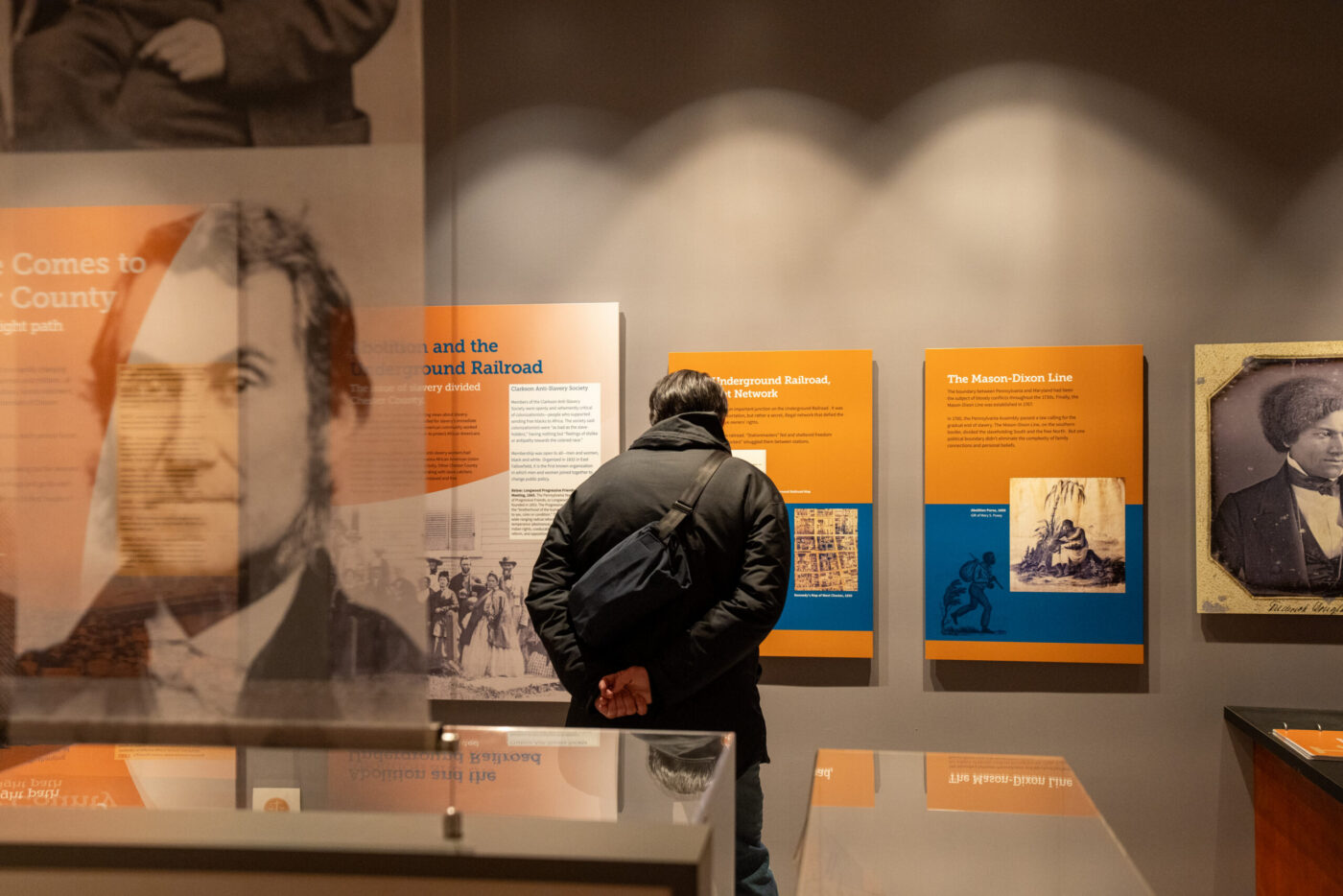 A museum visitor reads a placard at the Chester County History Center