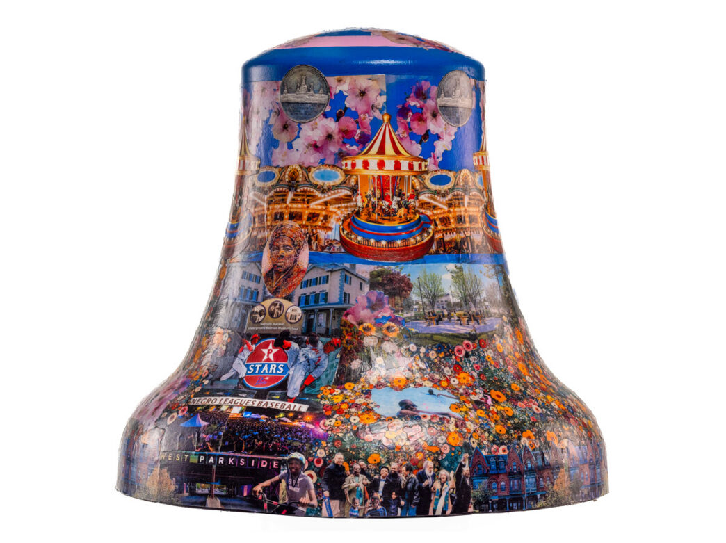 Collage-style painted bell representing Parkside in Philadelphia for Philadelphia250’s Bells Across PA, featuring a carousel, cherry blossoms, historic buildings, community scenes, and references to local history including Negro League baseball.