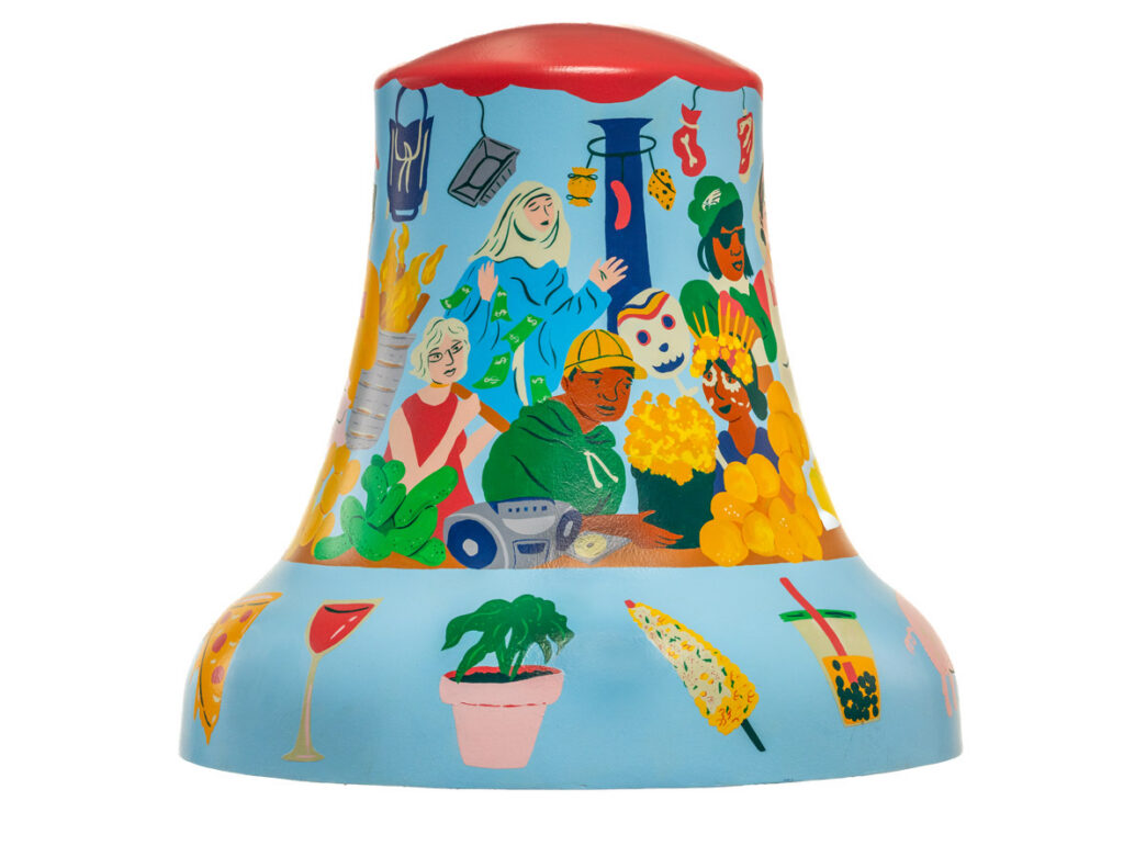 Bell sculpture titled “Open Everyday” from Philadelphia250’s Bells Across PA, featuring a lively collage of South Philadelphia culture. Stylized figures gather among food, music, and neighborhood imagery, including a street vendor, flowers, and hanging goods. The base showcases iconic items like pizza, a wine glass, a potted plant, corn on the cob, and bubble tea, highlighting the area’s diverse culinary and community life.