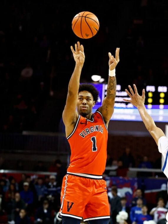 Virginia's Malik Thomas shoots over two defenders in his team's 72-68 win over Southern Methodist University.