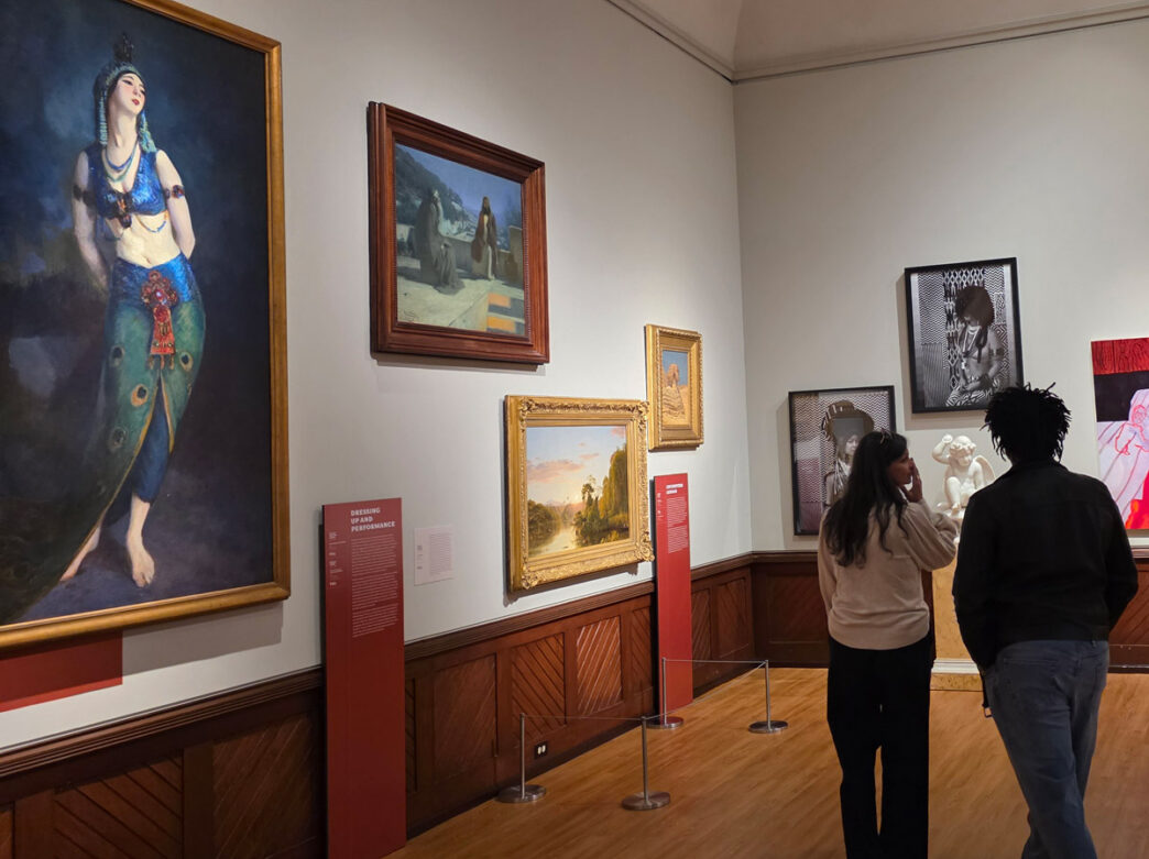 People observe artwork on display at the A Nation of Artists exhibit at the Philadelphia Museum of Art.