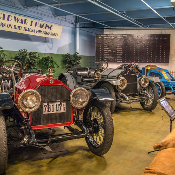 A visitor at the Simeone Foundation Auto Museum looks at racing cars from the pre-WWI era.