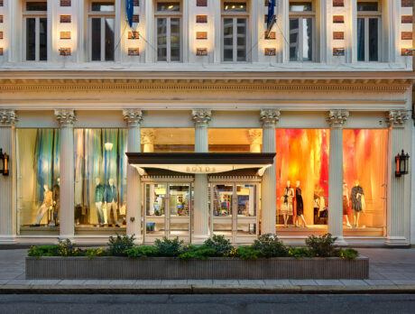The exterior of a brightly lit luxury store, Boyds Philadelphia, across a quiet street.