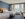 A brightly lit hotel room featuring blue carpets and walls, with two full sized beds at the Courtyard Philadelphia South at The Navy Yard
