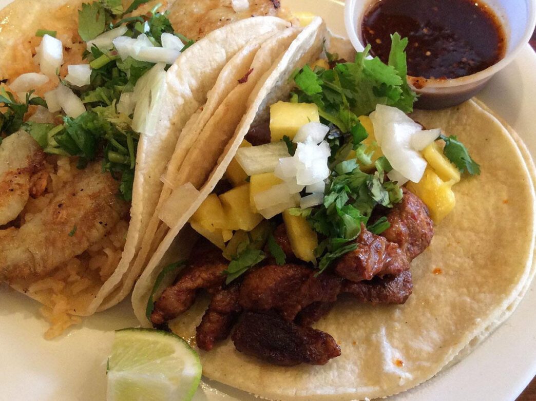A fresh plate of al pastor tacos from Taco Riendo Restaurant in Kensington