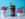 Three colorful alcoholic ice cream desserts from Tipsy Scoop Philadelphia displayed against a bright blue background. On the left is a pink "Spiked Water Ice" in a white cup topped with a cherry and spoon. In the center is a chocolate ice cream sundae topped with chocolate shavings and a football-shaped decoration. On the right is a bright pink ice cream swirl topped with decorative flowers and citrus slices. Each cup features the Tipsy Scoop branding and "#BOOZY ICECREAM" labels.