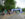 Visitors wearing soccer jerseys and team colors walk beneath the blue entrance arch to Philadelphia’s FIFA Fan Festival.