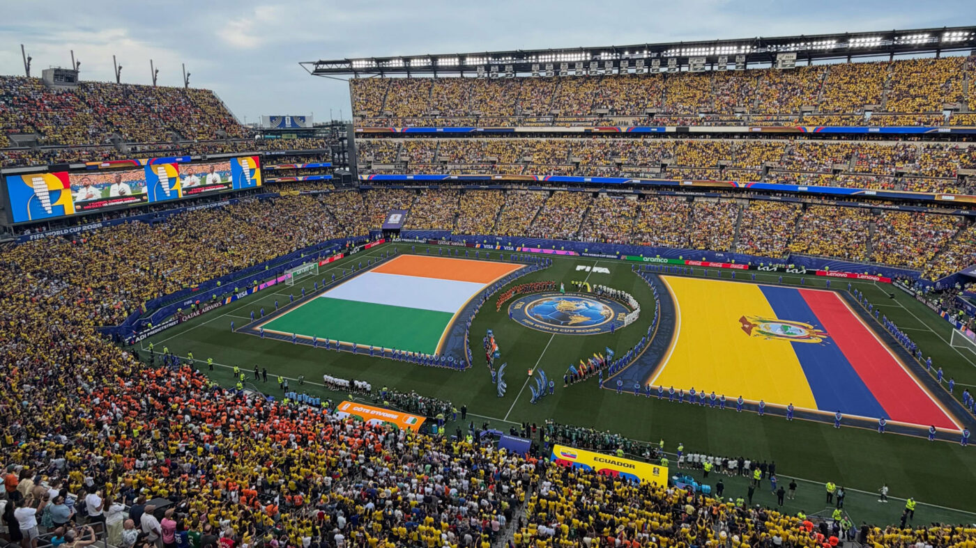 Lincoln Financial Field — known as Philadelphia Stadium for FIFA World Cup 26 — full of fans with large Côte d’Ivoire and Ecuador flags on the field during the pre-match national anthems and handshake