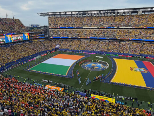 Lincoln Financial Field — known as Philadelphia Stadium for FIFA World Cup 26 — full of fans with large Côte d’Ivoire and Ecuador flags on the field during the pre-match national anthems and handshake