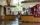 Visitors gather at information counters inside Philadelphia’s Independence Visitor Center, where staff assist guests with trip planning and tickets. Bright signage for Independence National Historical Park and local attractions hangs above the spacious, sunlit lobby with floor-to-ceiling windows.