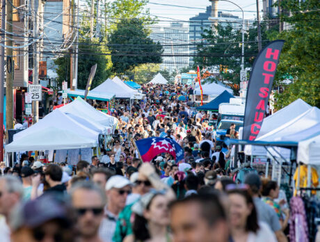 A large crowd fills North 2nd Street between rows of vendor tents and food trucks at the 2nd Street Festival in Northern Liberties.