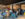 Customers work on laptops, chat and enjoy coffee inside Arterial Coffee, a spacious cafe with exposed brick columns, industrial ceilings and a colorful coffee bar.