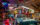 A vintage blue convertible is surrounded by colorful neon signs, toys, figures and other nostalgic memorabilia inside the American Treasure Tour Museum.