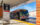 A SEPTA Route 82 bus bound for Frankford Transit Center waits at a boarding area on a sunny winter day.