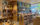 Inside the Julia de Burgos Bookstore at Taller Puertorriqueño. Books are displayed on shelves, with other products nearby