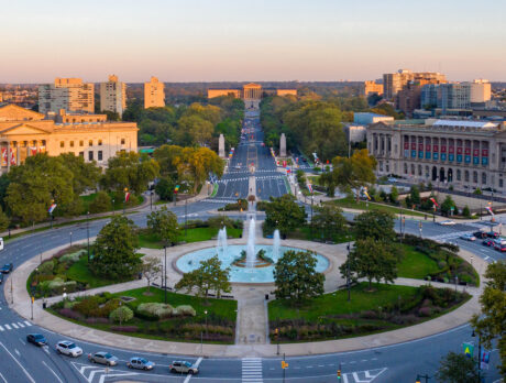 An aerial view of the Benjamin Franklin Parkway overlooking the fountain at Logan Square, the Barnes Foundation, Parkway Central Library and the Philadelphia Museum of Art.
